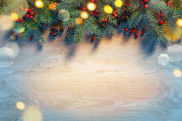 Christmas fir tree with lights Christmas fir tree with lights on wooden background. Merry Christmas and Happy New Year!! Top view. north pole photos stock pictures, royalty-free photos & images