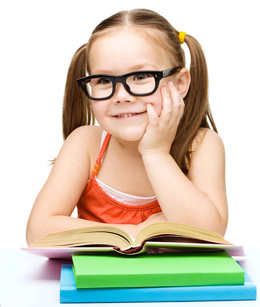 istock Little girl is reading a book 624985350