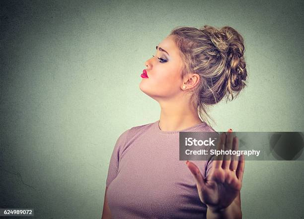 Snobby Annoyed Woman Giving Talk To Hand Gesture Stock Photo - Download Image Now - Snob, Women, Diva - Human Role