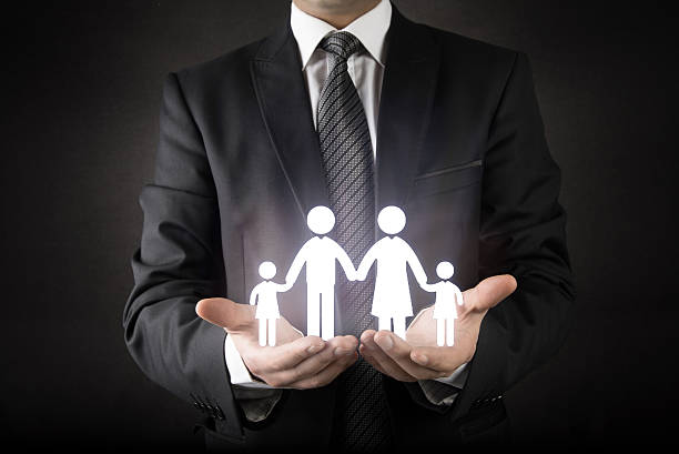 istock Businessman protecting, family concept 624990614