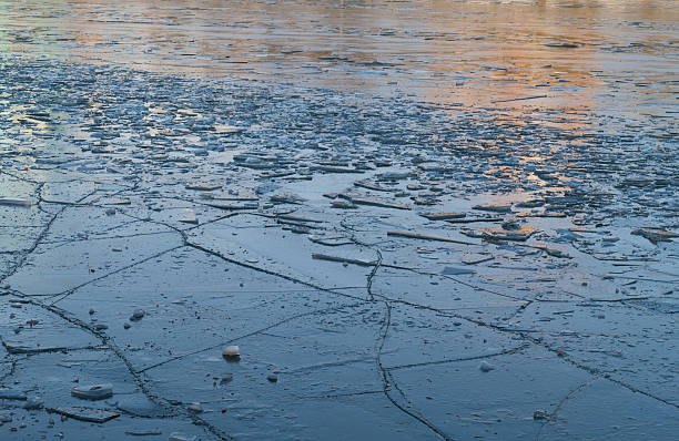 istock Ice cracked dangerous on the pond in November 624990882