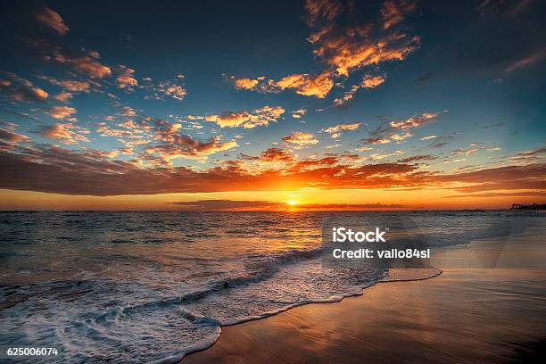 Sunrise Over The Beach Stock Photo - Download Image Now - Sunrise - Dawn, Beach, Sea