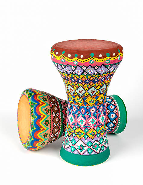 Two goblet drums (also chalice drum, tarabuka, darbuka, debuka) Front view of two colorful painted goblet drums (also chalice drum, tarabuka, darbuka, debuka, doumbek, dumbec, dumbeg, dumbelek, toumperleki, or tablah), single head membranophone with a goblet shaped body used mostly in the Middle East, North Africa, South Asia, and Eastern Europe goblet drum (also chalice drum tarabuka darbuka debuka) stock pictures, royalty-free photos & images