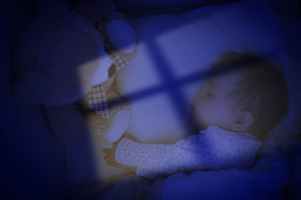 Two week old caucasian baby nursing bottle of milk themes of newborn innocent motherhood