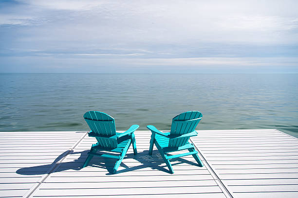 istock Two Muskoka Chairs Centered in the Dock 625008688