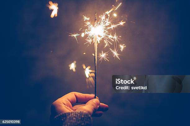 Sparkly Night Stock Photo - Download Image Now - Sparkler - Firework, Christmas, Adult