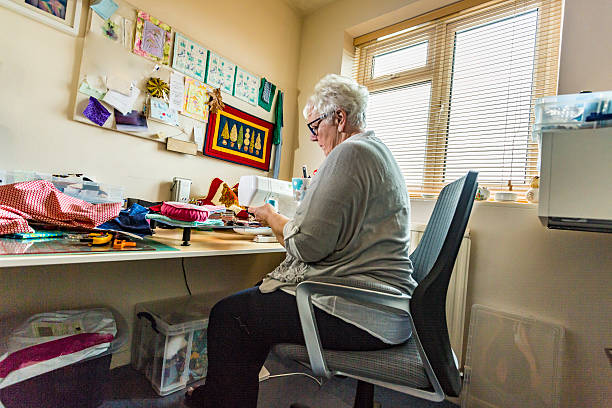 istock Senior Woman Sewing Quilts as a Craft Hobby 625011028