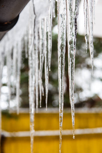 istock Icicles hang from the roof and dripping from them. 625011382