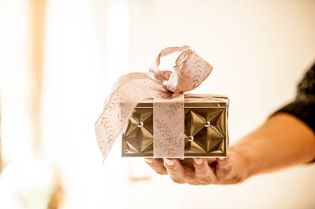 istock Woman Holding Christmas Present 625011626