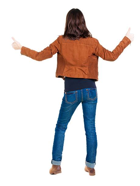 istock Back view of  woman thumbs up. 625036830