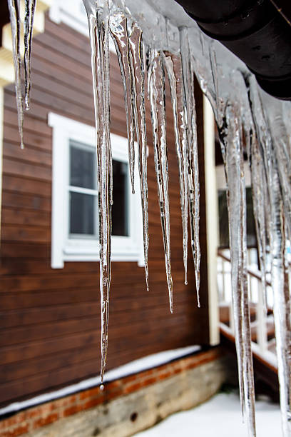 istock Icicles hang from the roof and dripping from them. 625036850