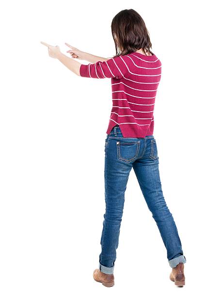 istock Back view of  pointing woman. 625037122