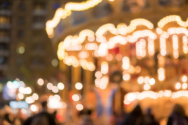 istock Blurred image bokeh of People walking around carousel 625041672