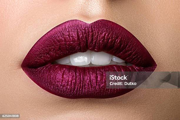 Closeup View Of Beautiful Woman Lips With Purple Matt Lipstick Stock Photo - Download Image Now