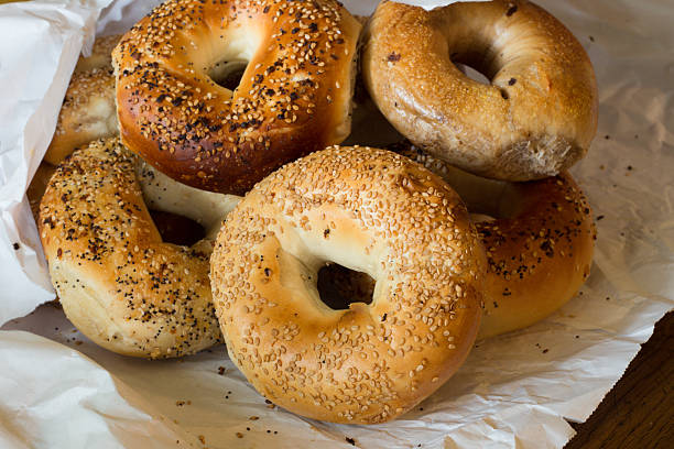 Bagels Variety of Authentic New York style bagels with seeds in a paper bag number 12 photos stock pictures, royalty-free photos & images