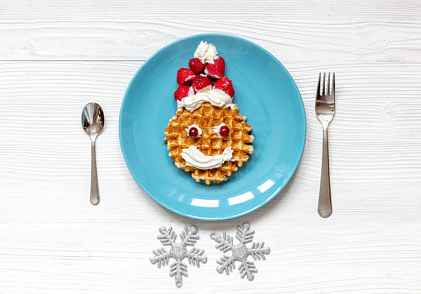istock breakfast for child on Christmas with waffle top view 625057946