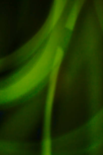 istock Dark overlay background of green LED lights 625058244