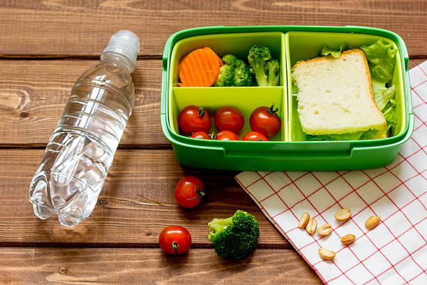 istock lunch box for kid with fresh vegetables on wooden background 625058562