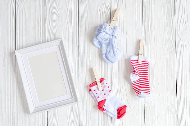 istock baby shower - blank picture frame on wooden background 625059972