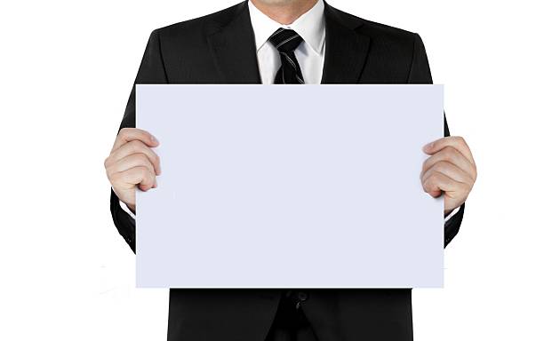 istock Man in suit holding blank sign board with hand 625061932
