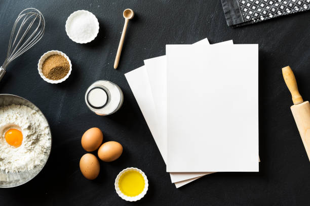 istock Baking recipe, blank white cover magazines on blackboard 625062620