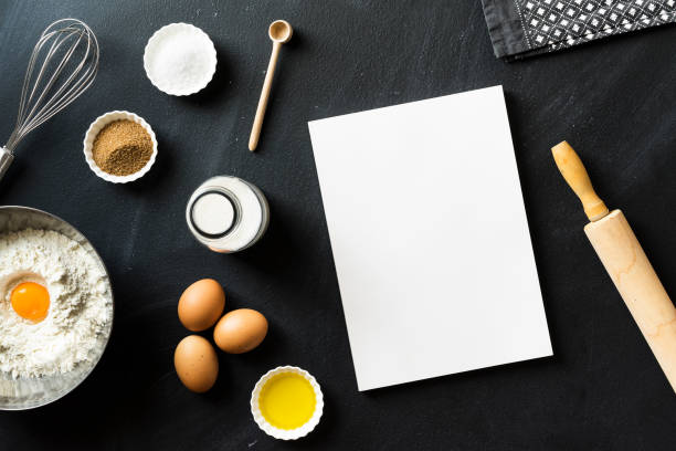 istock Baking recipe, blank white cover magazine on blackboard 625064060
