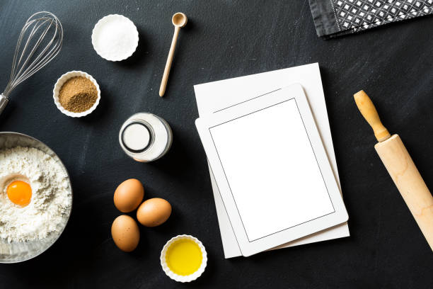 istock Baking recipe, blank screen mobile devices and white magazine 625064834