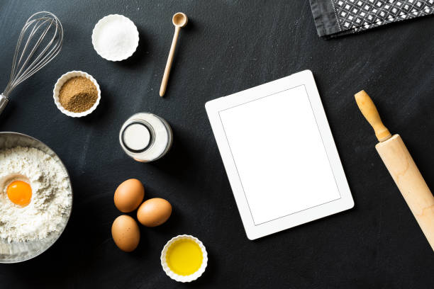 istock Online baking recipe, blank screen tablet pc on blackboard 625065526
