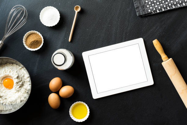 istock Online baking recipe, blank screen tablet pc on blackboard 625066222