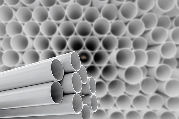 istock PVC pipes stacked in warehouse. 625067118