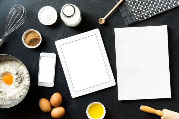 istock Baking recipe, blank screen mobile devices and white magazine 625067518