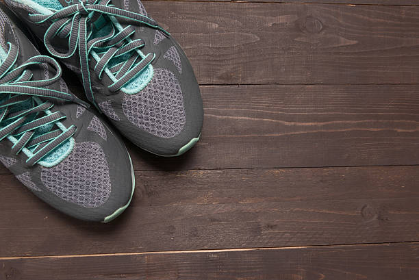 istock Sneakers is on the wooden background 625067894
