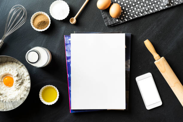 istock White cover magazine, blank screen phone, baking concept flat lay 625069148