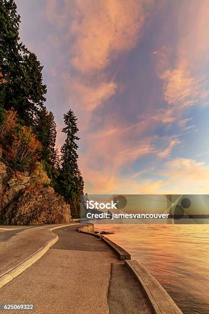 Seawall And Rock Wall At Sunset Stock Photo - Download Image Now - Vancouver - Canada, Awe, Back Lit