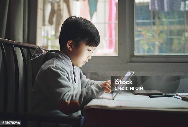 Boy With Tablet Stock Photo - Download Image Now - Child, Digital Tablet, Asia