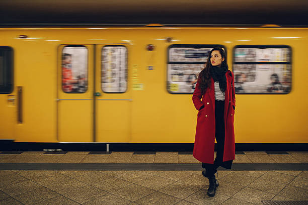 istock Young woman in Berlin subway station 625070388