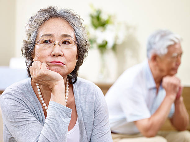 unhappy senior asian couple - arguing senior adult conflict couple imagens e fotografias de stock