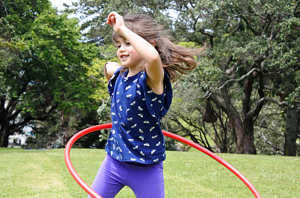 istock Little girl plays with Hula Hoop 625081138