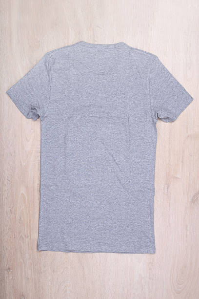 istock Back view gray t-shirt on wooden background 625081306
