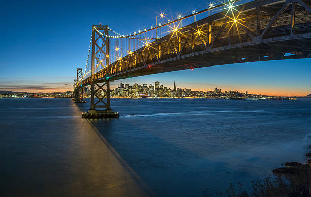 istock Bay Bridge and skyline of San Francisco at night 625095568