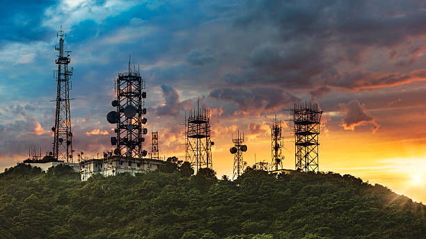 Silhouette Antenna towe with sunset background Silhouette Antenna tower and repeater of Communication and telecommunication with the mountain on the background of sunset.Hong Kong China. communications tower broadcasting antenna telecommunications equipment stock pictures, royalty-free photos & images