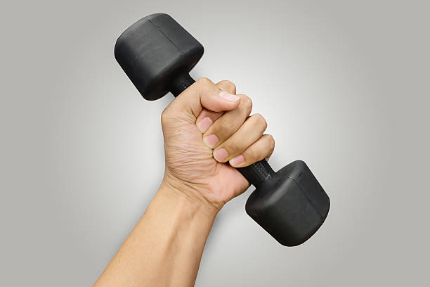 istock Hands holding dumbbells in sport club 625122580