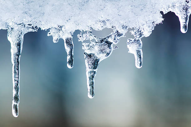 istock beautiful shiny transparent icicles hang on a clear day 625126672