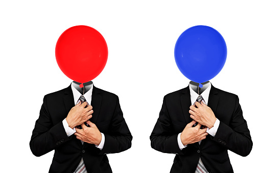 Red and Blue balloons instead head of businessman in black suit, isolated on white background