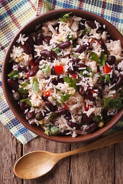 istock Rice with red beans and vegetables in bowl close-up. vertical 625135846
