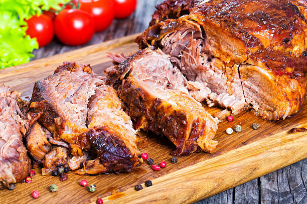 istock Big Piece of Slow Cooked Oven-Barbecued Pulled Pork shoulder 625136024