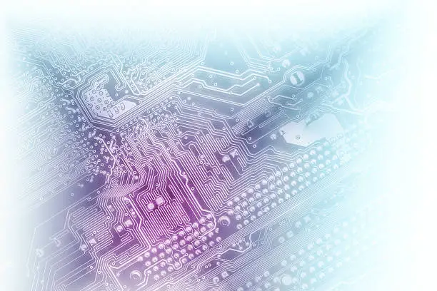 Macro shot of a circuit board, as a technology background. Suitable for your business it presentation. Colored in blue and violet light colors, faded into white.