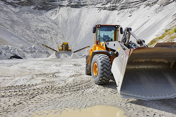 Quarry aggregate with heavy duty machinery. Construction industr stock photo