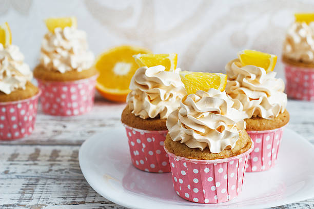 istock Vanilla cupcakes with a cap of cream 625150266