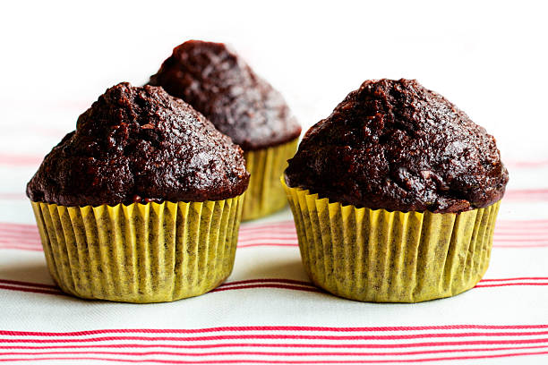 Chocolate Muffins on a Red Striped Tablecloth